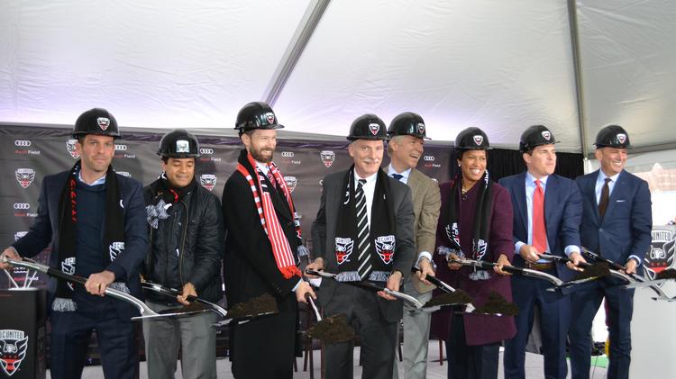 Officials from the District government, Audi North America and Major League Soccer join D.C. Mayor Muriel Bowser, third from right, at a groundbreaking for Audi Field. 