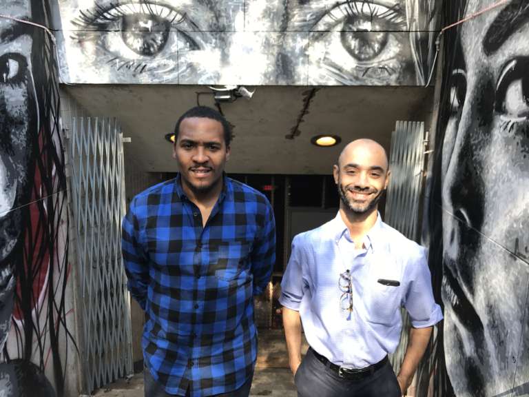 David Ross and Kristopher Johnson-Hoyle stand in front of the entrance to the Dupont Underground. (WTOP/Rachel Nania)