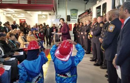 Twin brothers Zephaniah Chamber, 6, and Dylan Chambers, 6, hold onto their hats as they watch Mayor Muriel Bowser announce the opening of the new Engine Company 22 firehouse on upper Georgia Avenue to a crowd of Ward 4 neighbors. The ribbon cutting ceremony on February the 16th, 2018 marks 121 years since Brightwood Park updated its original chemical firehouse which employs 12 fireman who operate a fire truck, a fire engine, and an ambulance. (Julia Airey/The Washington Times) 