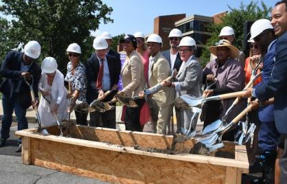 D.C. Mayor Muriel Bowser, joined by city officials and project developers, breaks ground for construction on the Abrams Hall Senior Apartments on the campus of the former Walter Reed Army Medical Center in northwest D.C. on July 16. (Roy Lewis/The Washington Informer)