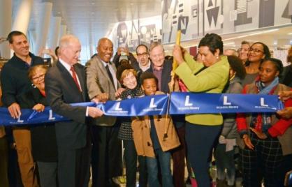 Mayor Muriel Bowser - with government, library, business and community leaders and artists, cut the ribbon to open the West End Library. Photo by Patrick G. Ryan
